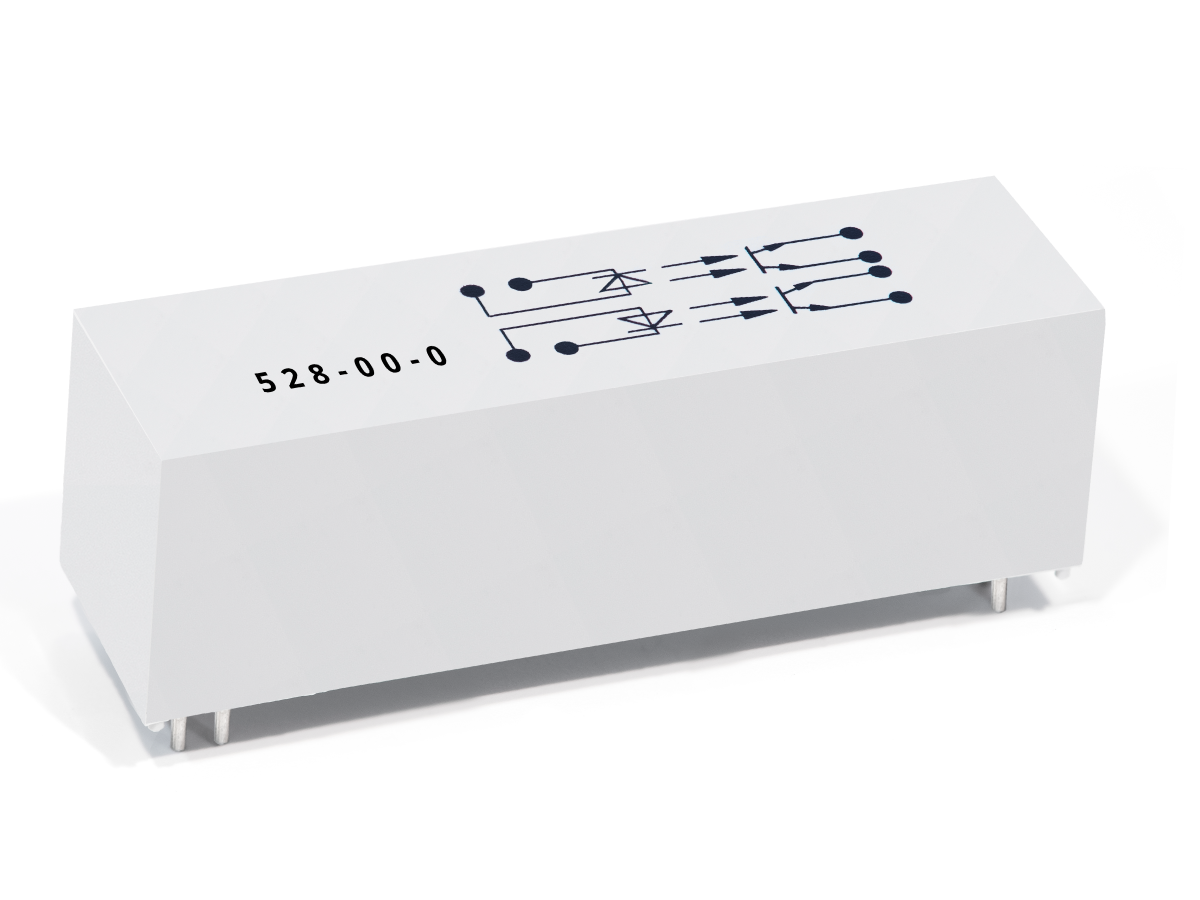 A white rectangular electronic relay from the 528 Series Optocouplers, featuring four metal pins and a schematic diagram with symbols and the number 528-00-0 printed on the top surface. by Standex Detect
