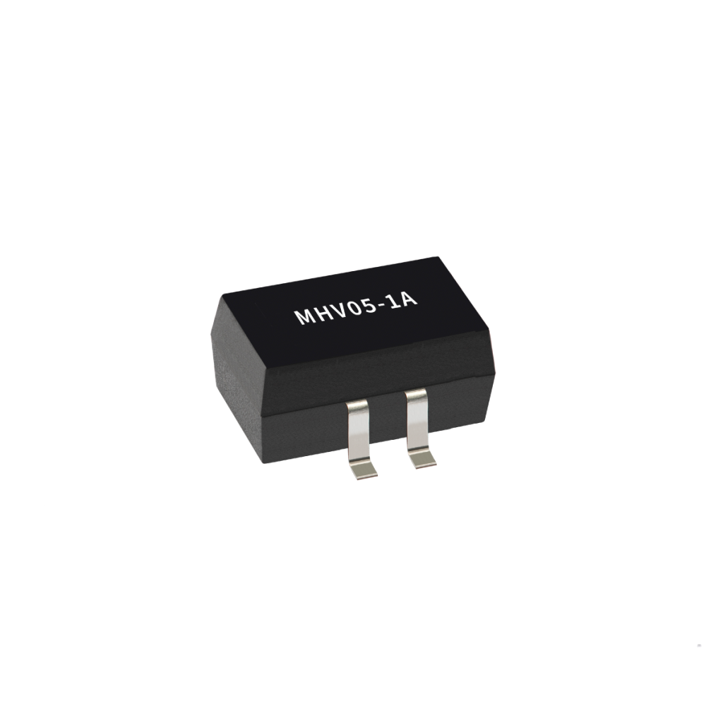 A small black Reed Relay electronic component from the MHV Series with three metal pins and white text MHV05-1A on its surface, isolated on a white background. by Standex Detect